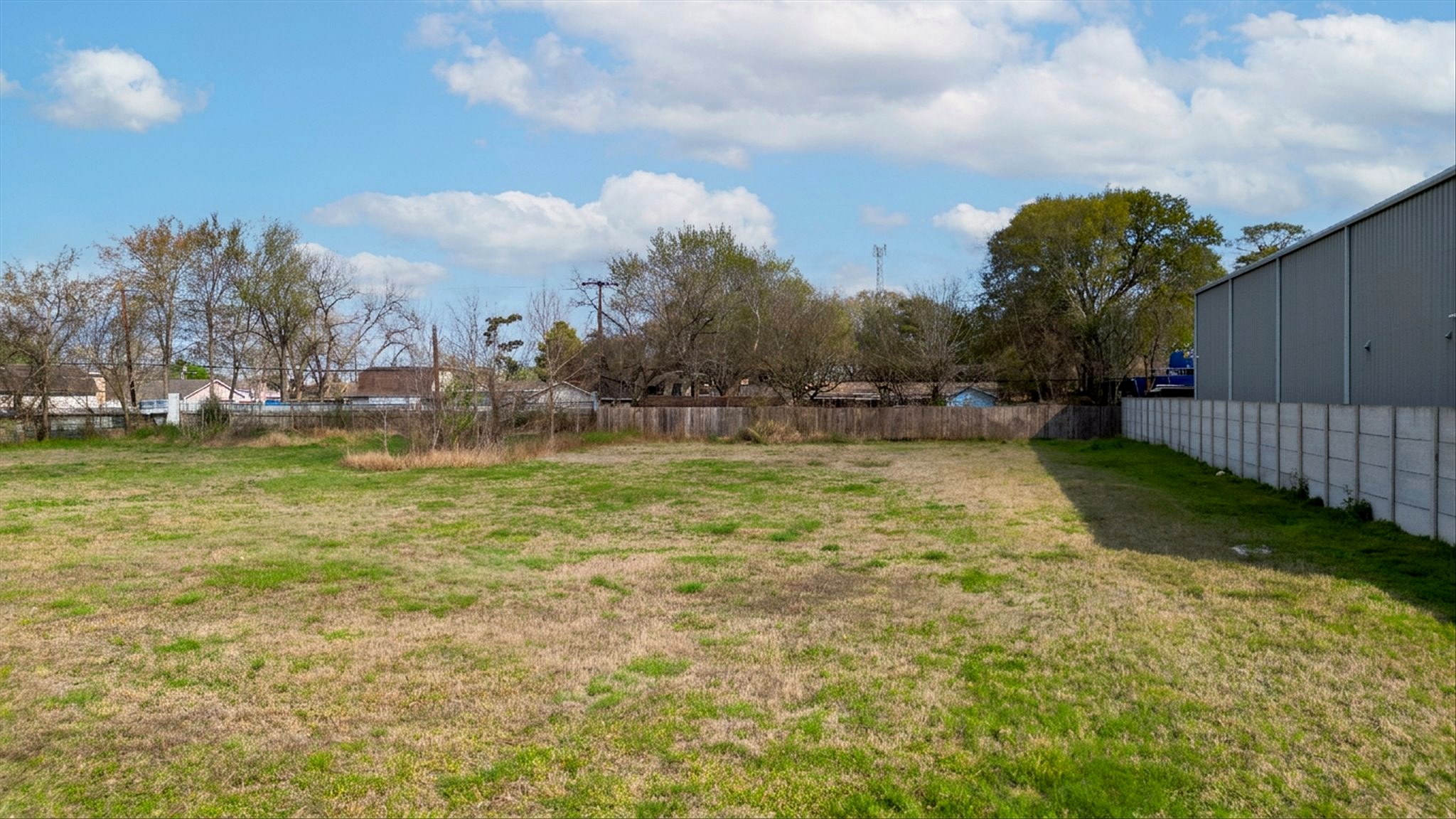Ground-level view showing vacant cleared lot
